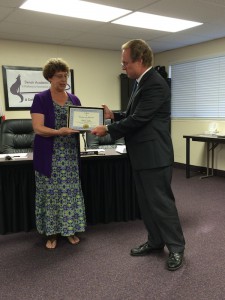 Becky Julien receives certificate from Superintendent Rosander