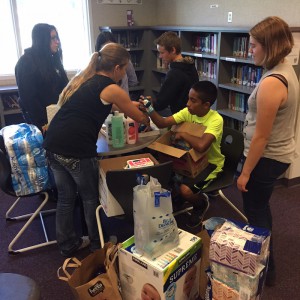 Denair Middle School students Emma Webster, Abigail Martinez, Jacob Lewellen, Jorge Yanez and Chole Padgett organize donated items in the library.